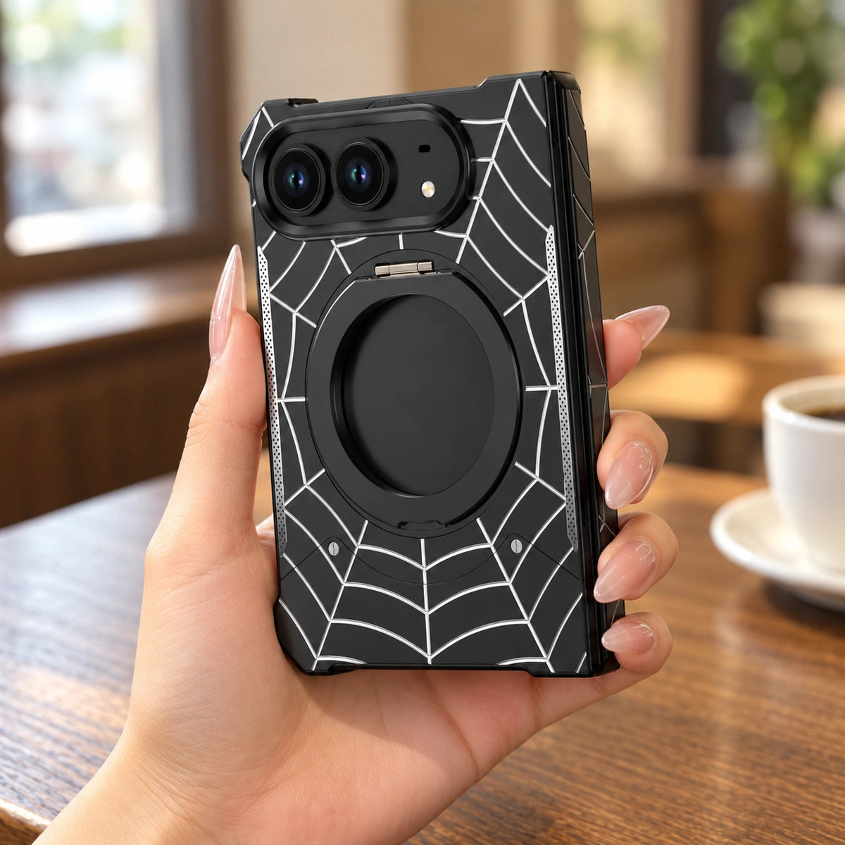 Spiderweb Armor Ring Stand iPhone Duo Case, held in hand
