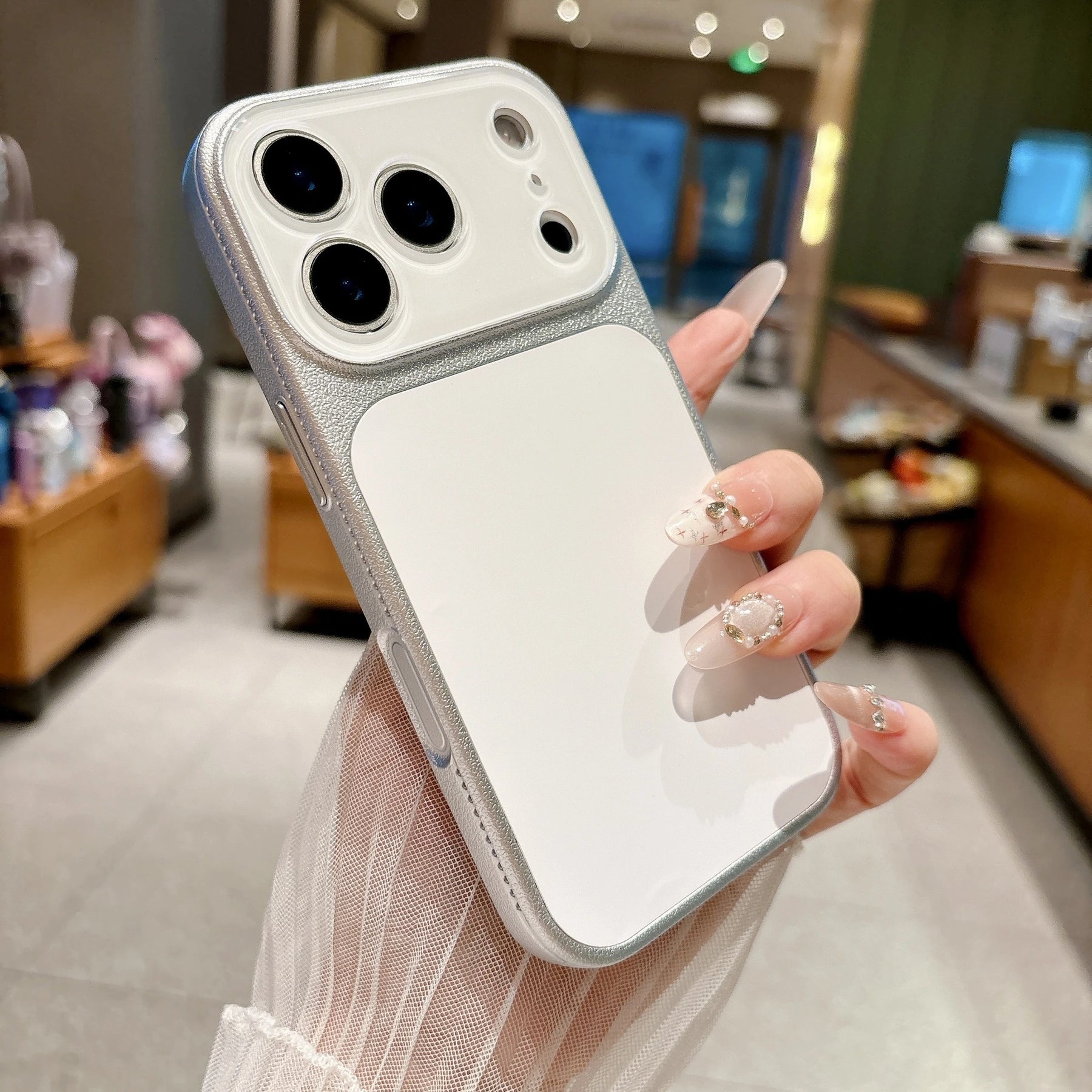 Pearl white faux leather color block iPhone case lifestyle photo
