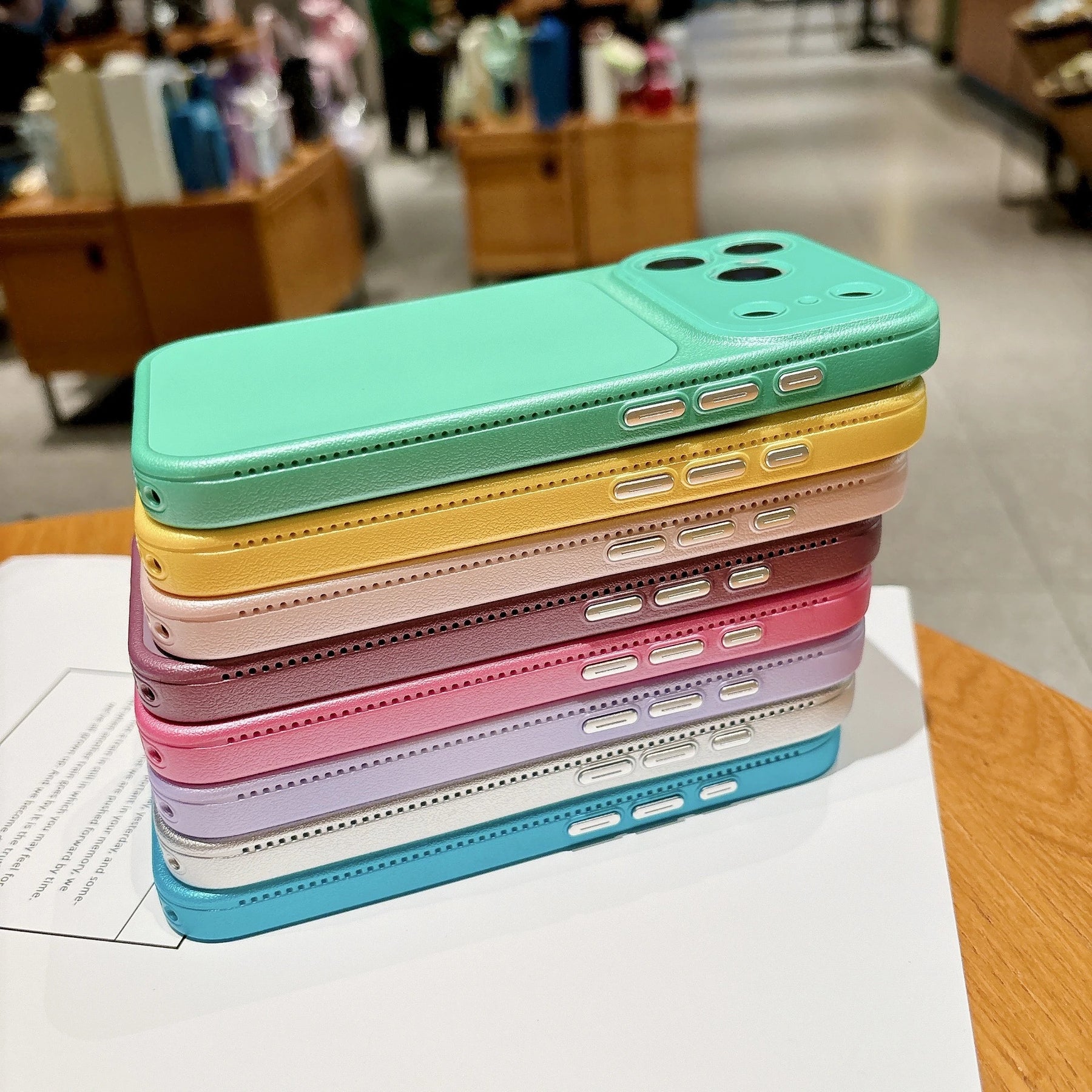 Faux leather color block iPhone case metallic button detail