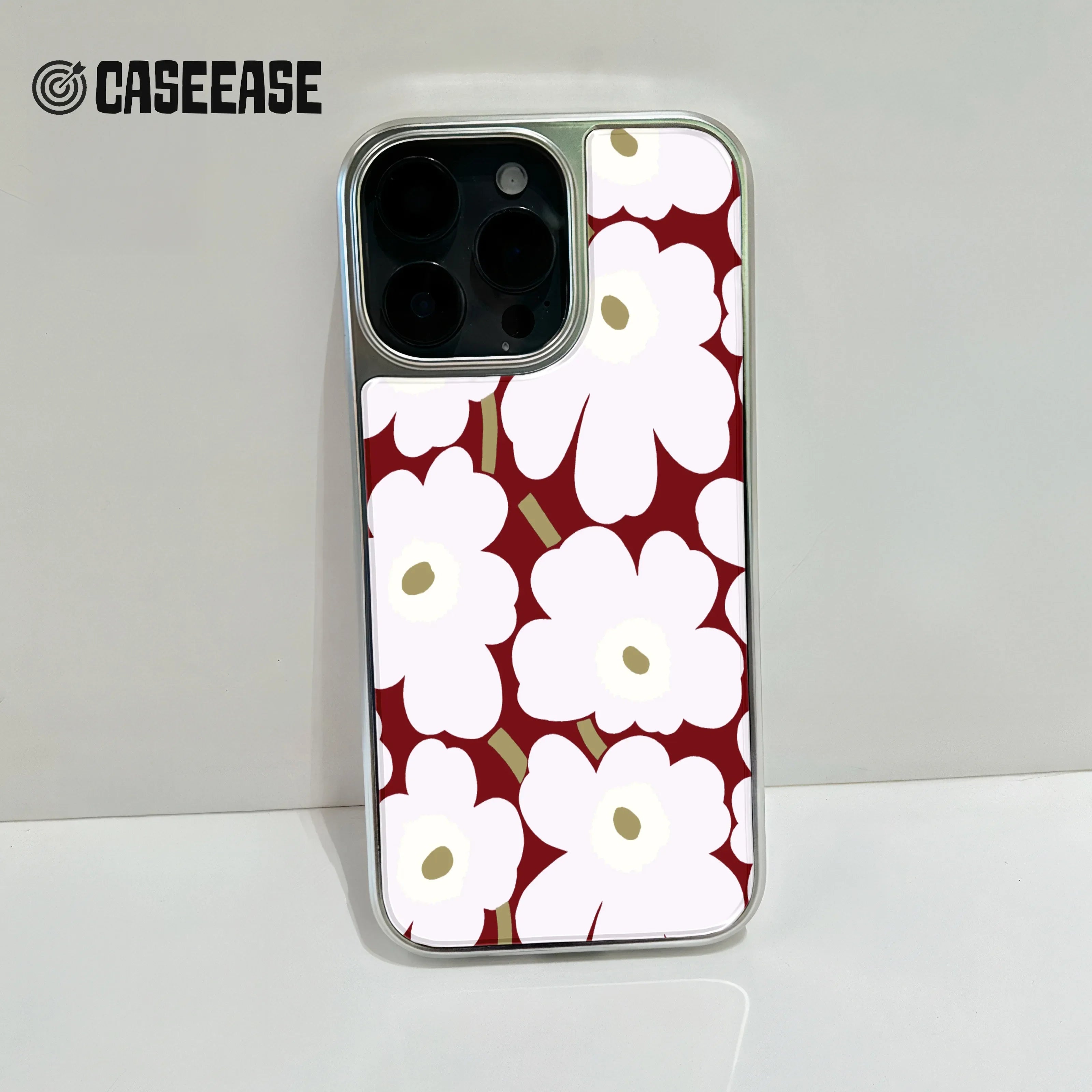 Holographic Chrome Phone Case for iPhone 15 Pro - Floral Design on Burgundy Background
